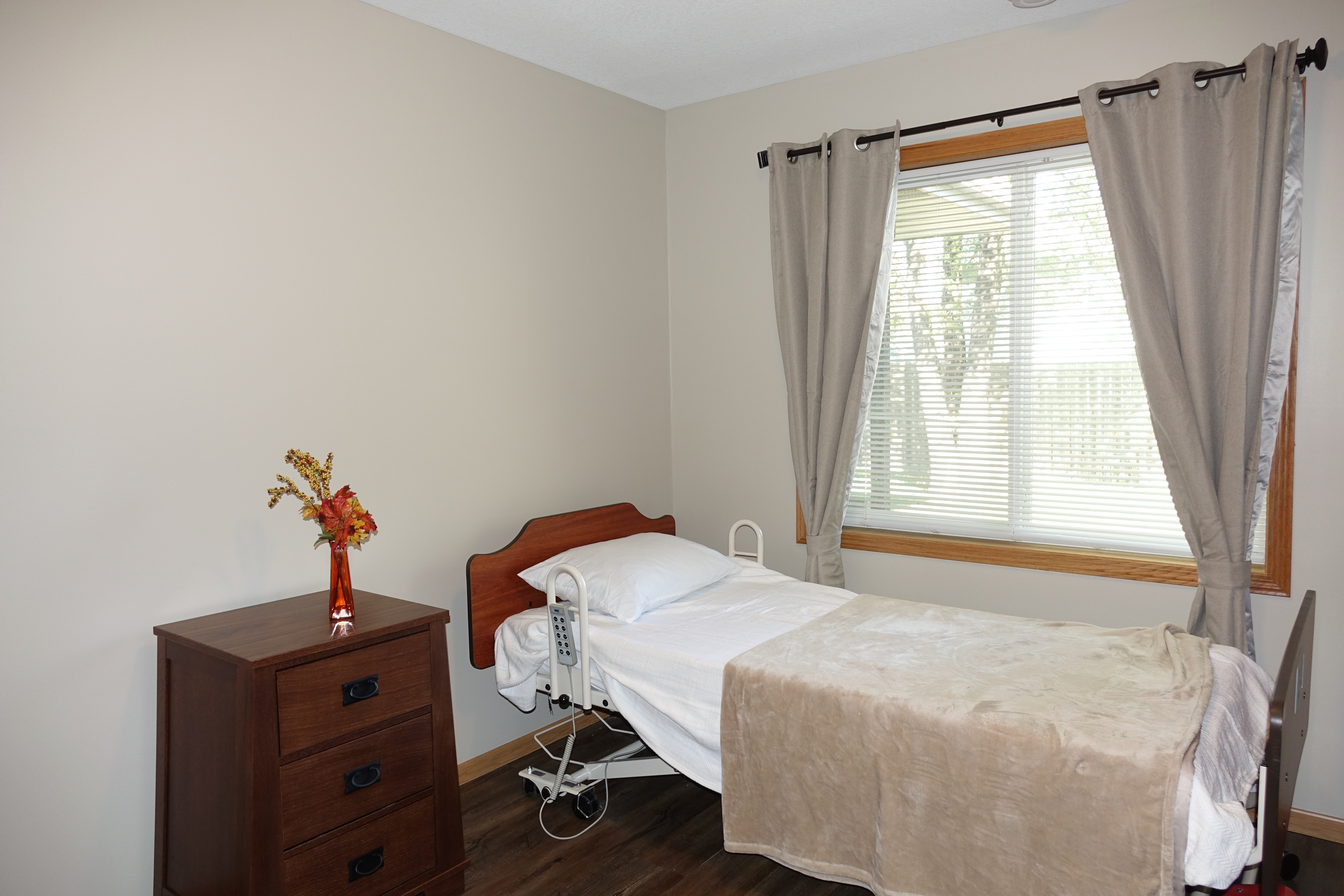 Resident bedroom with adjustable care bed