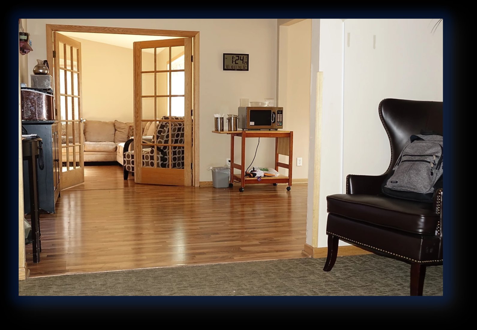 Hardwood entryway with French doors to the sunroom