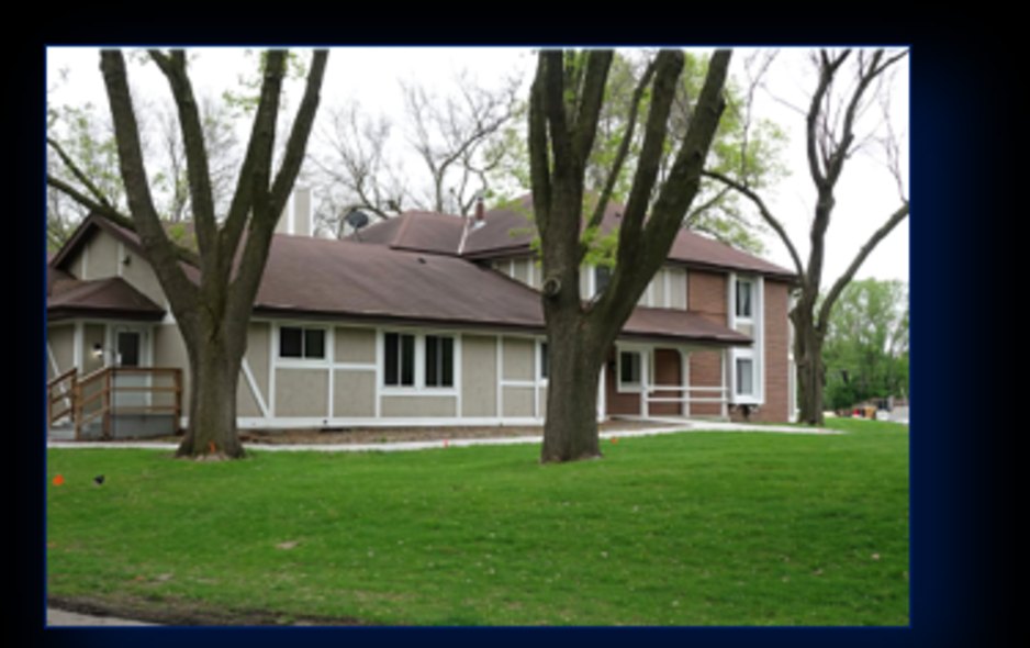 Back deck with grill and shaded seating