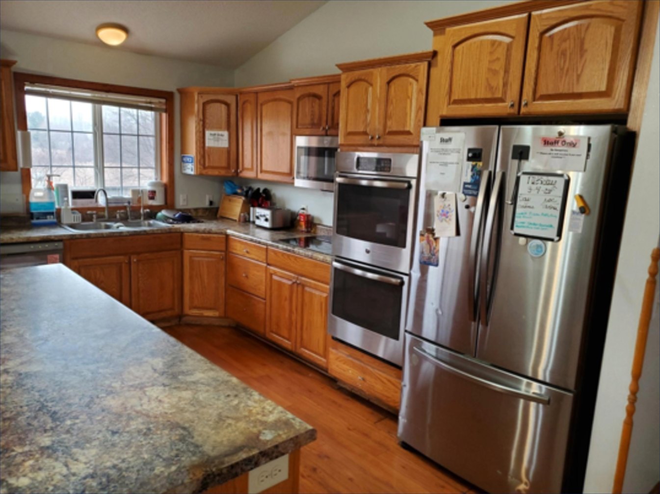 Full kitchen with oak cabinets and stainless appliances