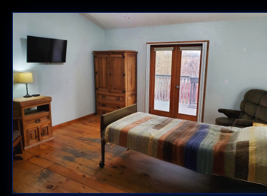 Resident bedroom with balcony doors