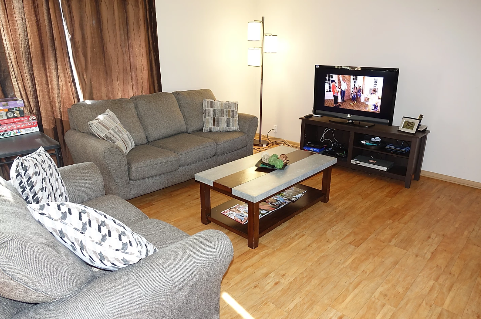 The Lodge of Mendota Heights great room with stone fireplace